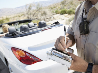 photo of police writing a ticket for reckless driving in VA